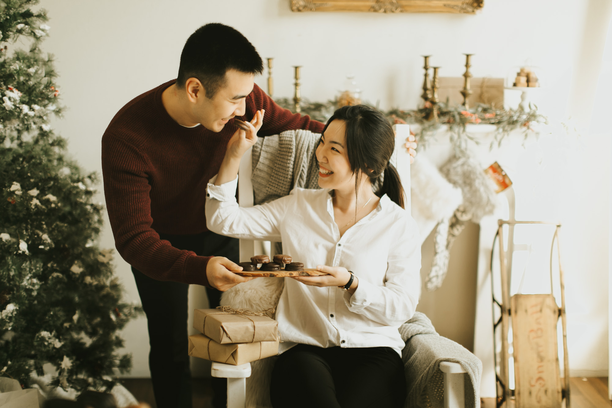 husband and wife sharing hall's chocolate-covered oreos at Christmas dinner