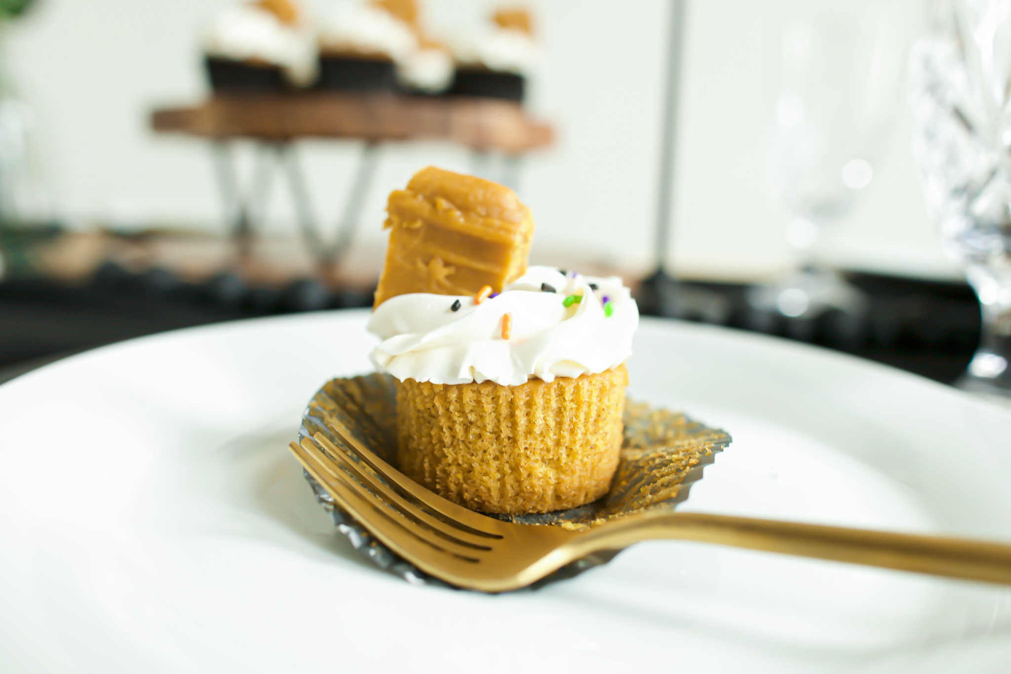 gold fork with pumpkin cupcakes and cream cheese frosting with pumpkin fudge