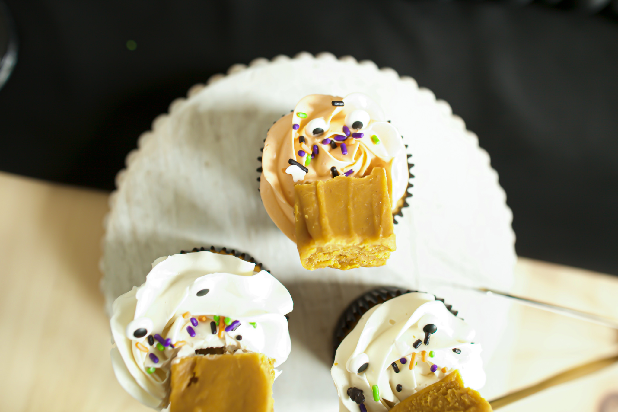halloween pumpkin cupcakes with sprinkles and google eyes 